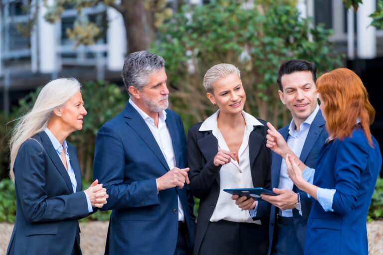 Corporate Discussion Between Two Executives in Business District